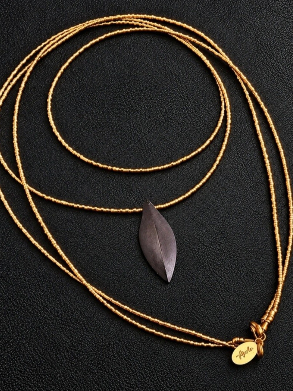 Akola Gold Multi Strand Beaded Necklace Black Leaf Pendant Statement